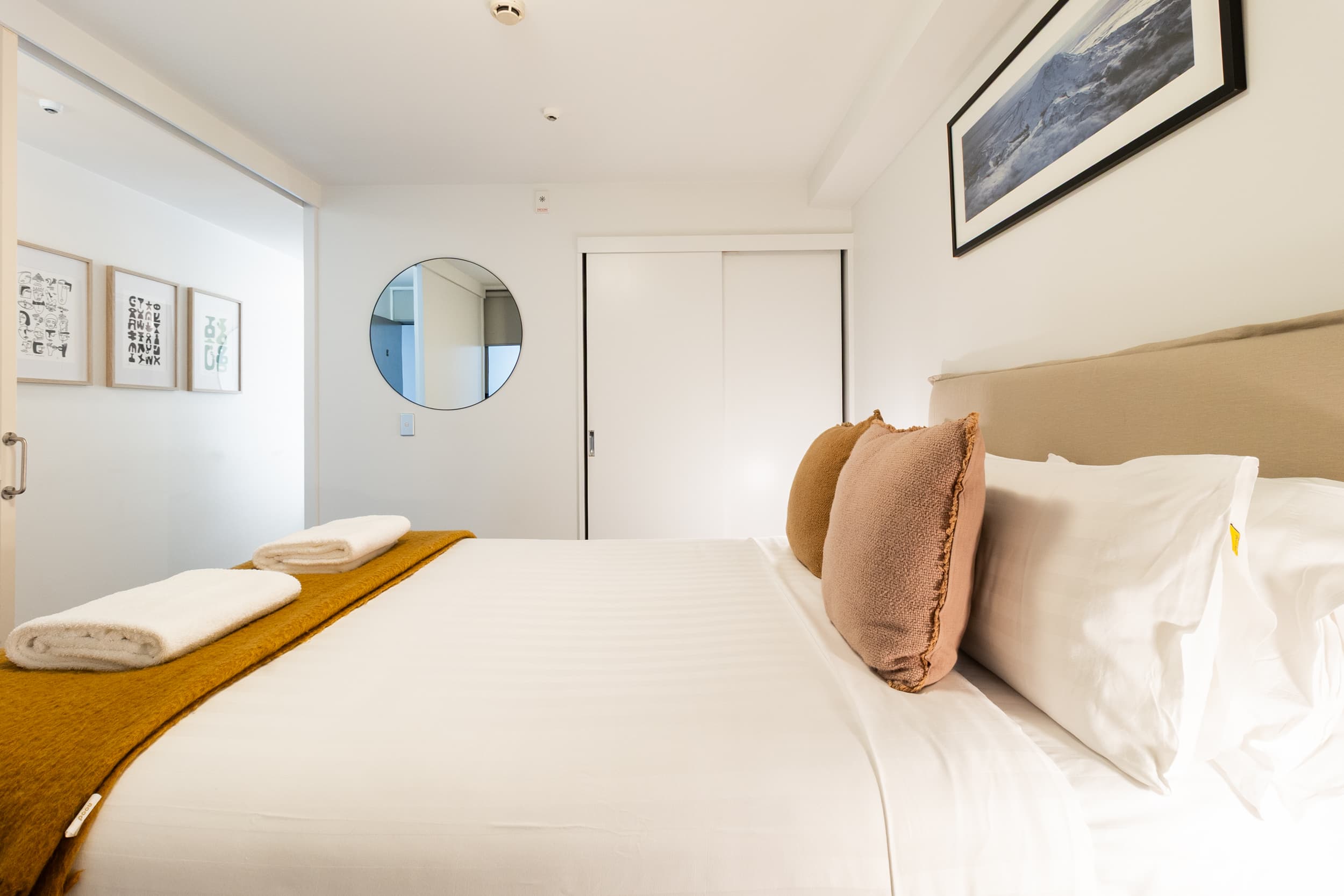 Bedroom with wardrobe and art